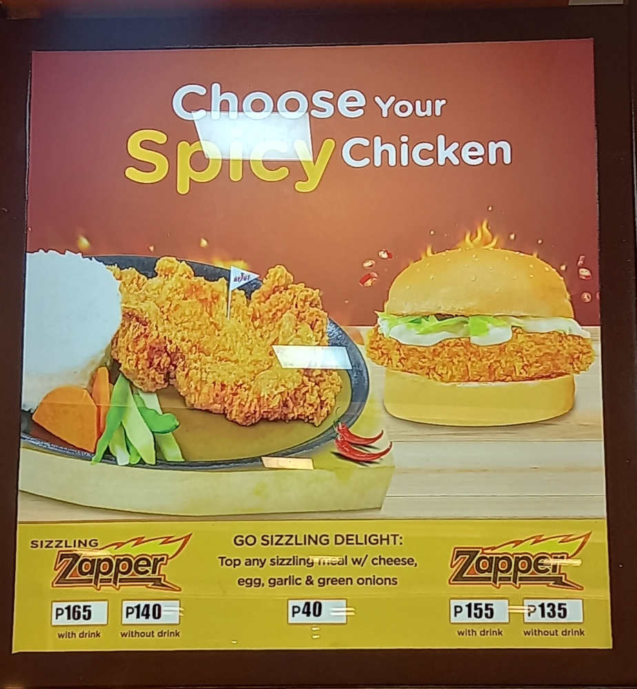 Orange Brutus menu featuring Sizzling Zapper and Zapper Burger that can be ordered with drinks or no drinks. It also includes toppings like cheese, egg, garlic & onions.