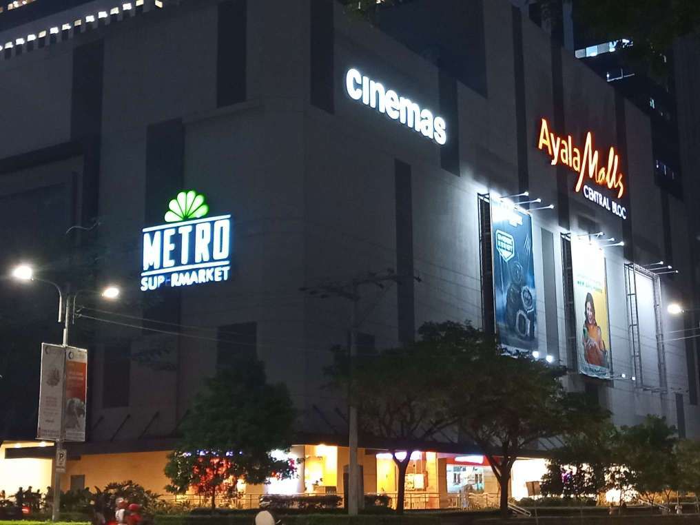 Ayala Malls Central Bloc and Metro Supermarket LED signages turned on and shot outside their buliding at night.