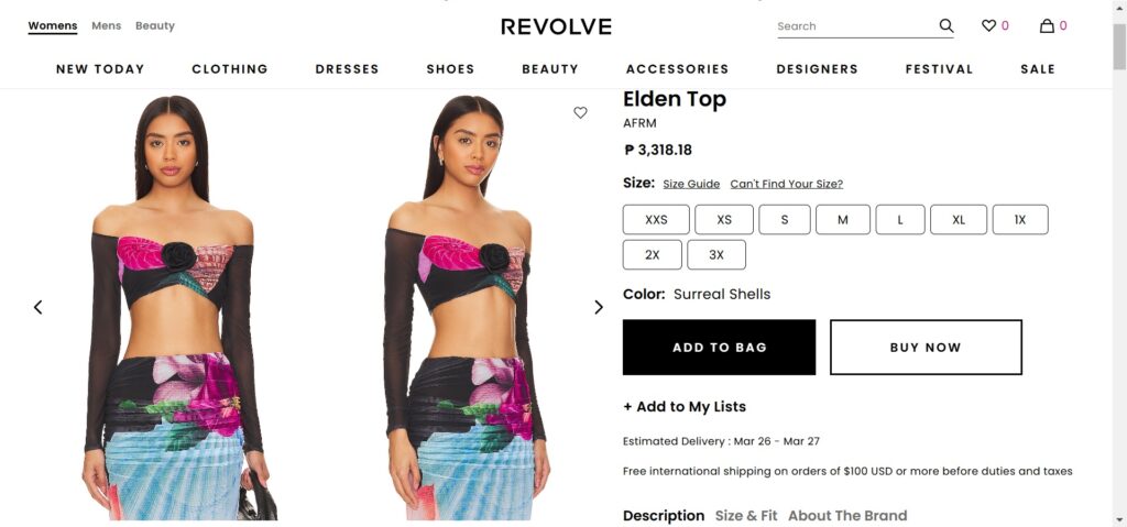 This is a website from Revolve showcasing the Elden Top with Surreal Shells color of the AFRM Clothing Brand. This page is the shopping page and shows a model wearing the top in two different angles. It shows the price at around ₱3,318.18. The top comes in different sizes. This product is displayed in an all white background webpage.