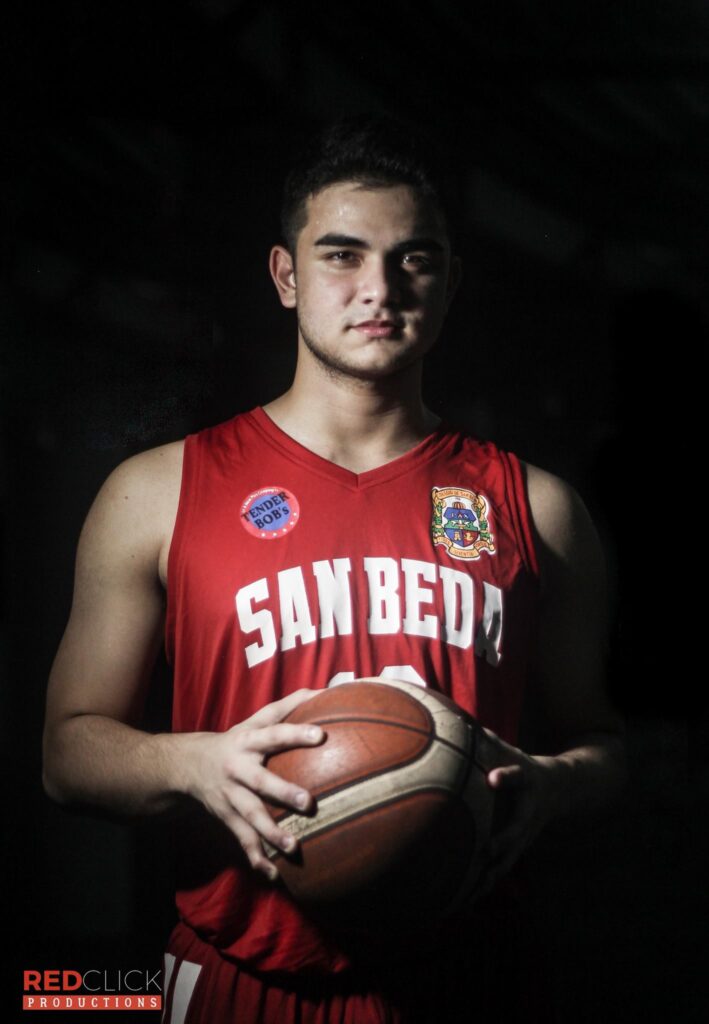 Sam Fernandez (Samuel Abu Hijle) the ex-boyfriend of Andrea Brillantes. Wearing a red San Beda College jersey and holding a basketball.